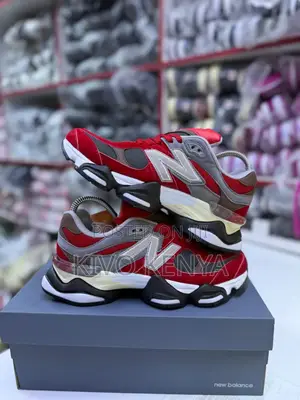 New Balance 9060 Sneakers in a Red and Grey Colorway.