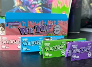 We Top 1 1⁄4 Colored Rolling Papers - 100 Leaves ( Full Box)