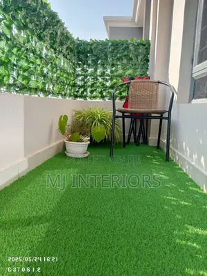 Modern Balcony Design With Grass Carpet Privacy Fence