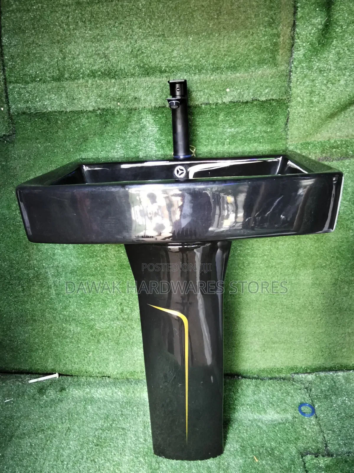 Black Designed Washhandbasin With a Gold Strip