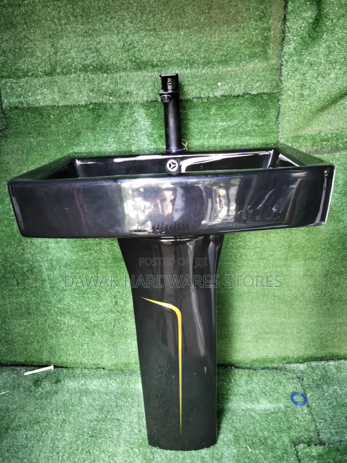 Black Designed Washhandbasin With a Gold Strip