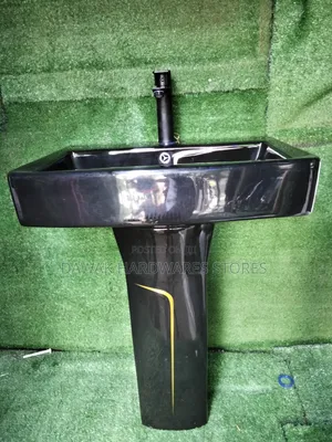 Black Designed Washhandbasin With a Gold Strip