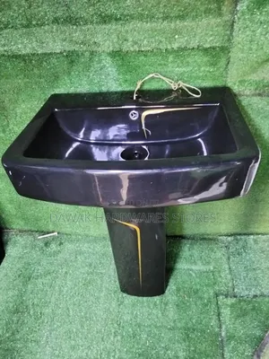 Black Designed Washhandbasin With a Gold Strip