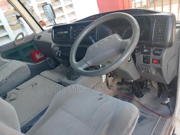 Toyota Coaster 2015 White - thumbnail 3