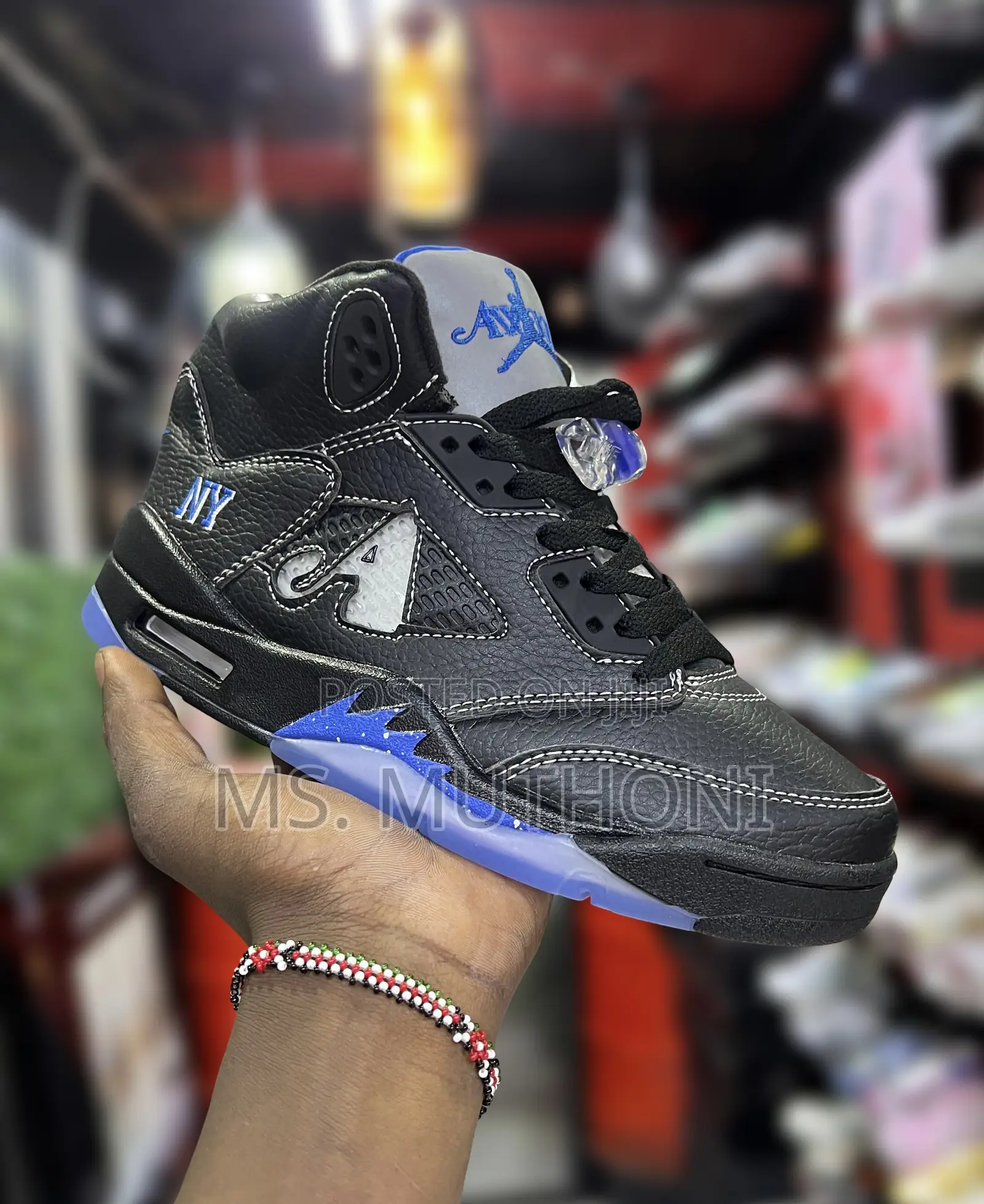 The Nike Air Jordan 5 Retro Awake Ny Black Sneakers.