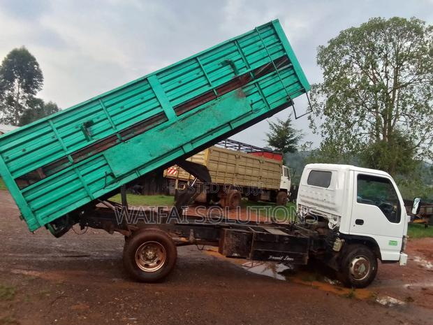 Isuzu NPR Openbody With a Tipping Jark Kcu - thumbnail 2