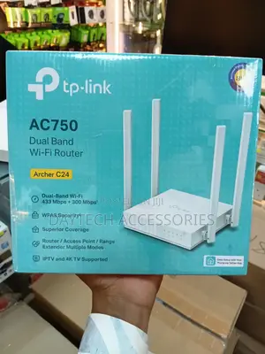 This Is a Tp-Link Archer C24 Ac750 Wireless Dual Band Router in White.