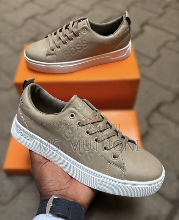Hugo Boss Men's Leather Sneakers Featuring a Thick White Rubber Sole.