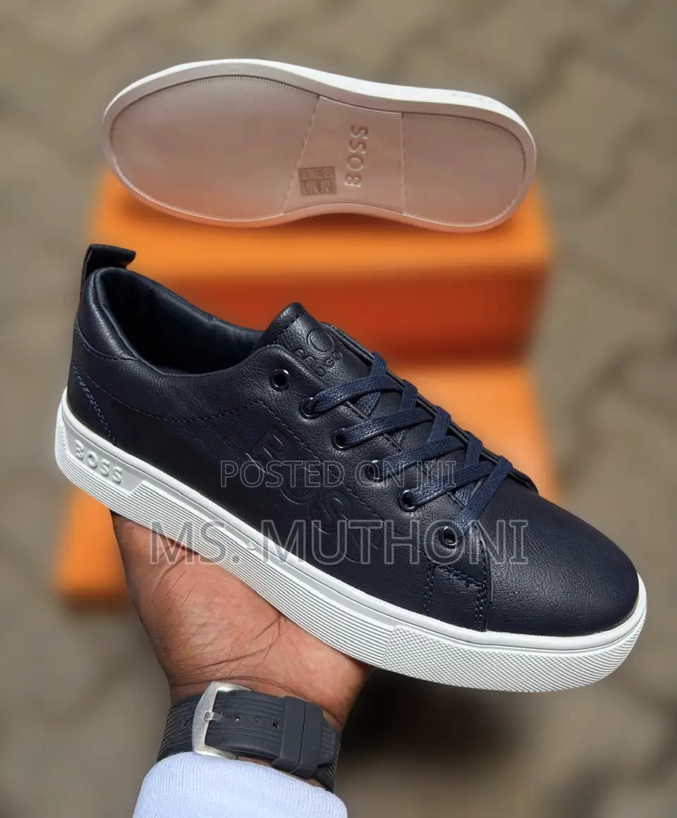 Hugo Boss Men's Leather Sneakers Featuring a Thick White Rubber Sole.
