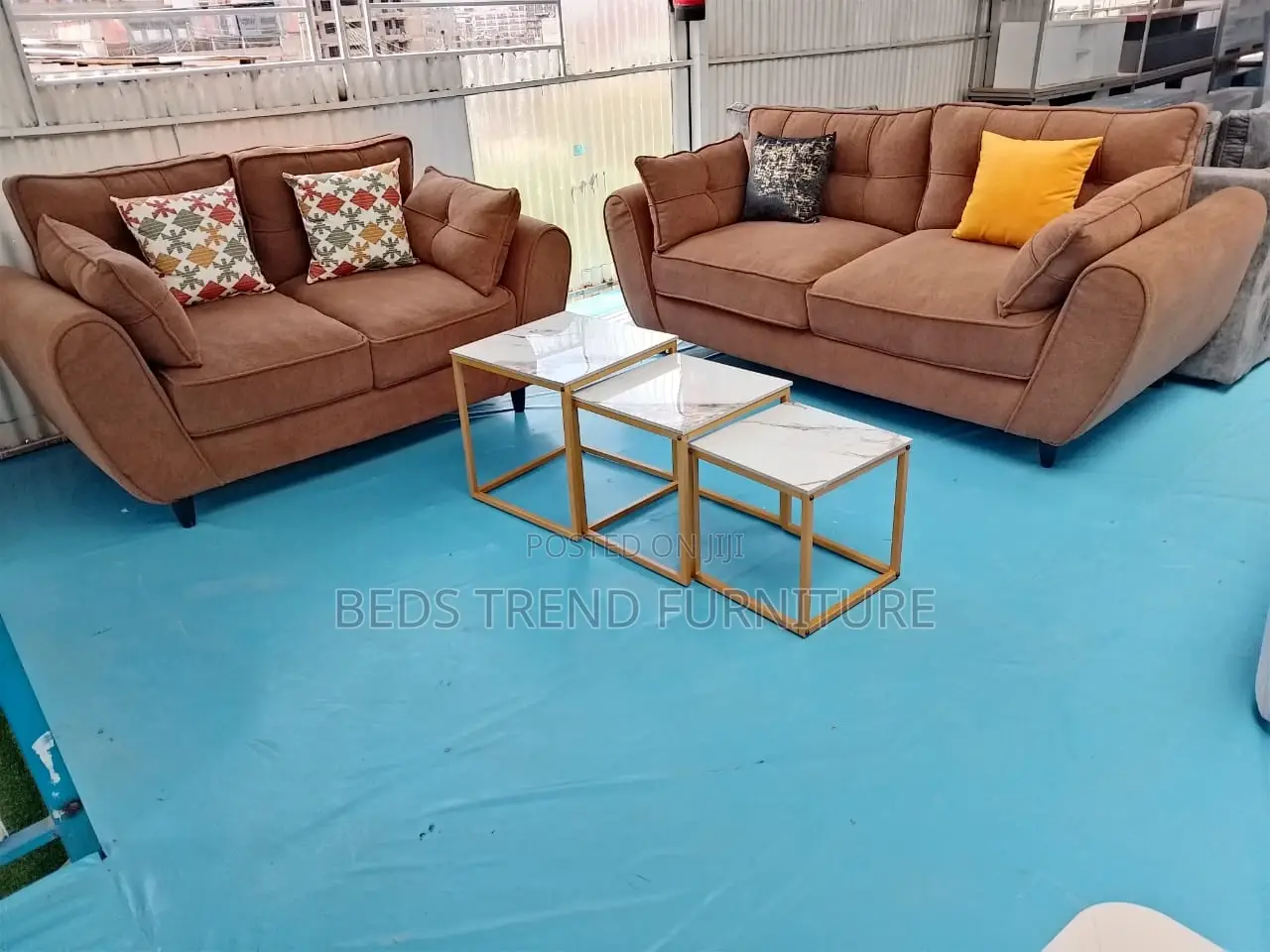 5 Seater Pair of Brown Butterfly Sofas.