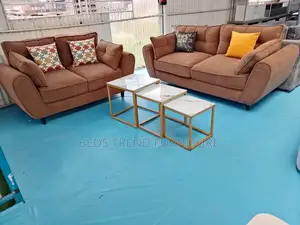 5 Seater Pair of Brown Butterfly Sofas.