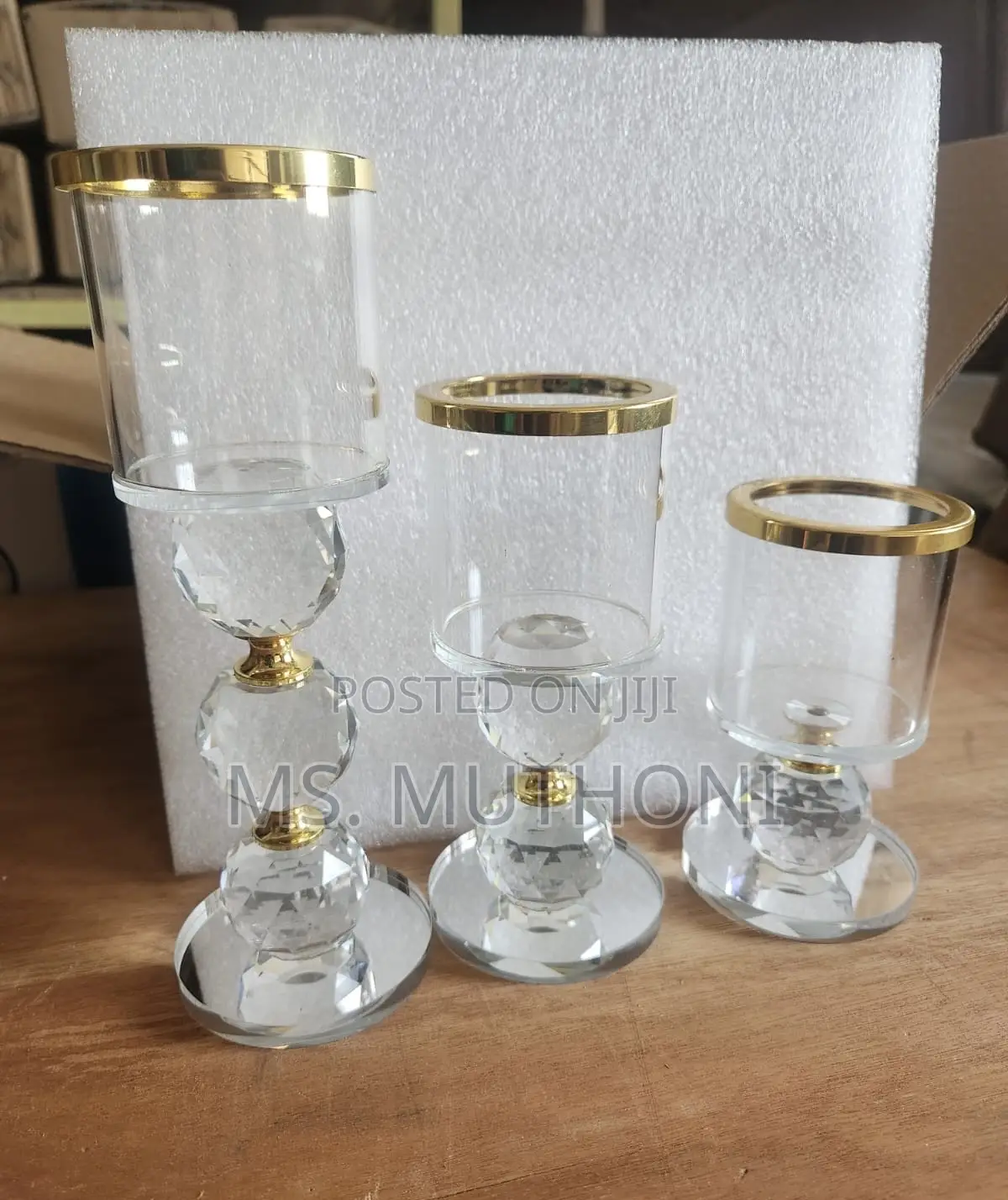 Crystal Pillar Candle Holder Set of Three With Gold-Rimmed Glass Tops.