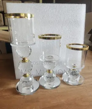 Crystal Pillar Candle Holder Set of Three With Gold-Rimmed Glass Tops.