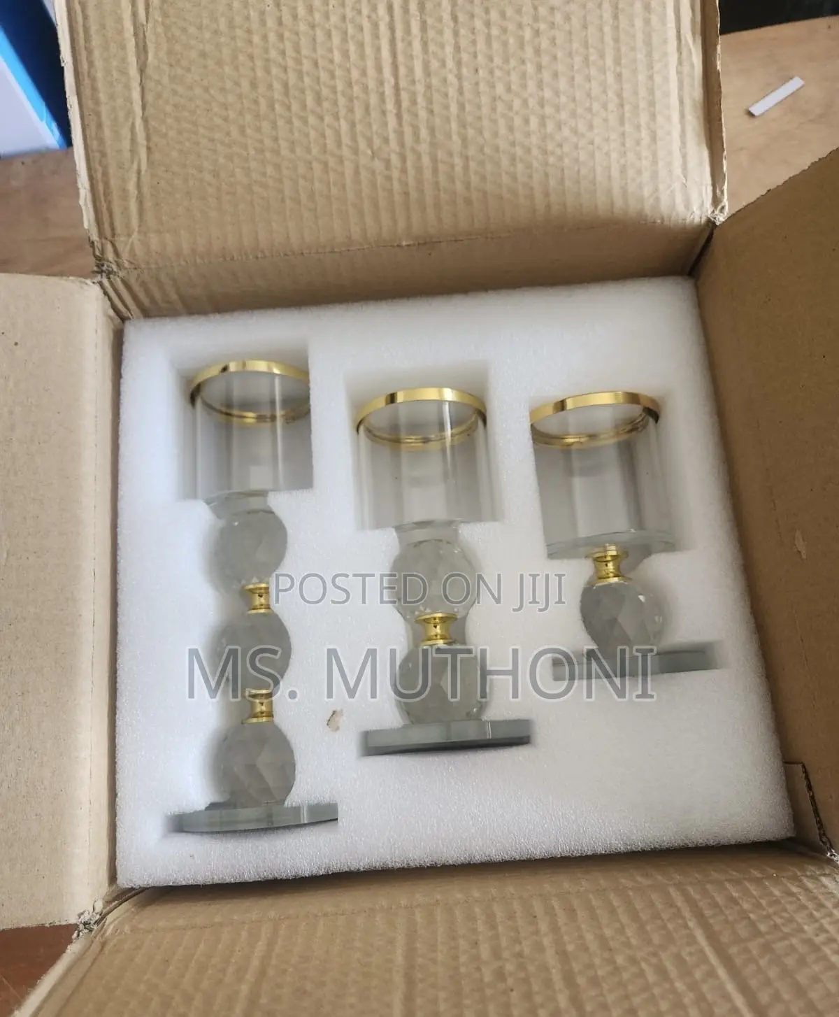 Crystal Pillar Candle Holder Set of Three With Gold-Rimmed Glass Tops.