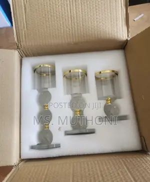 Crystal Pillar Candle Holder Set of Three With Gold-Rimmed Glass Tops.