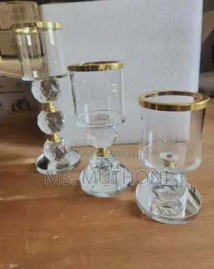 Crystal Pillar Candle Holder Set of Three With Gold-Rimmed Glass Tops.