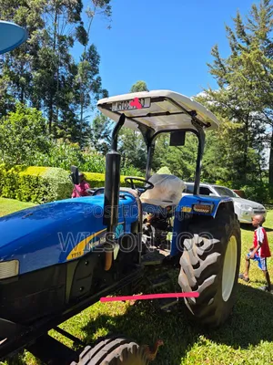 Newholland Tt 55 With Plough and Trailer