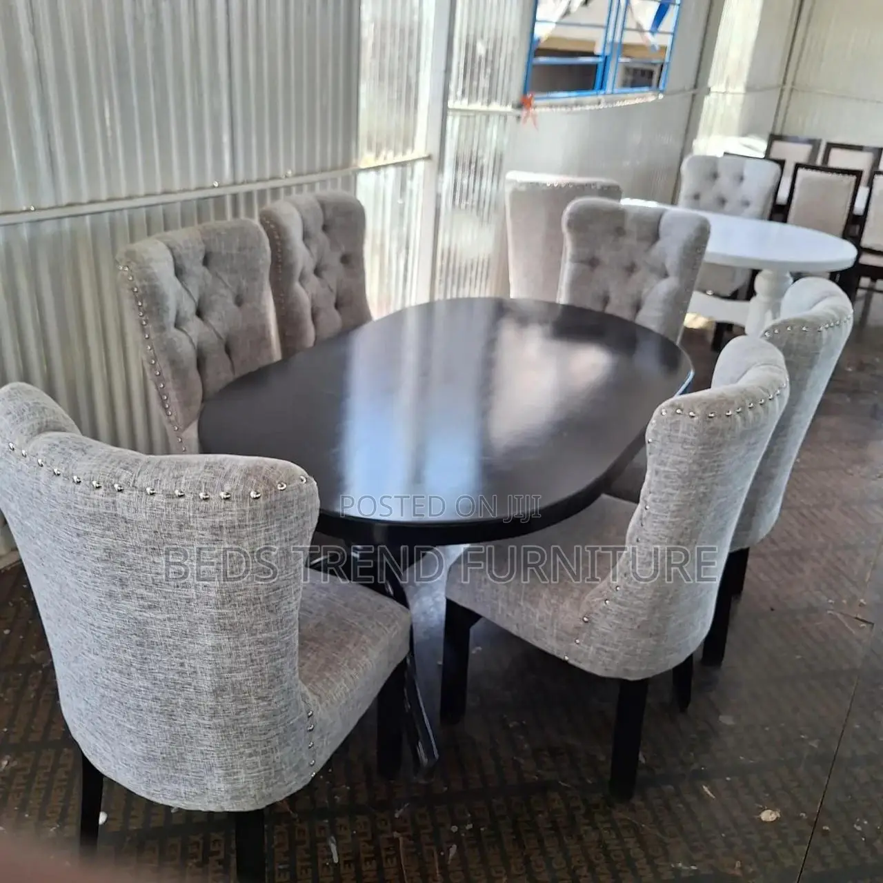 6-Seater Oval Dining Table With Tufted Chairs