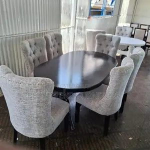 6-Seater Oval Dining Table With Tufted Chairs