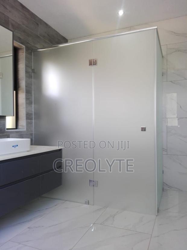 Custom Frameless Shower Enclosure Featuring Frosted Tempered Glass