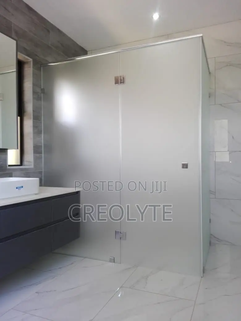 Custom Frameless Shower Enclosure Featuring Frosted Tempered Glass