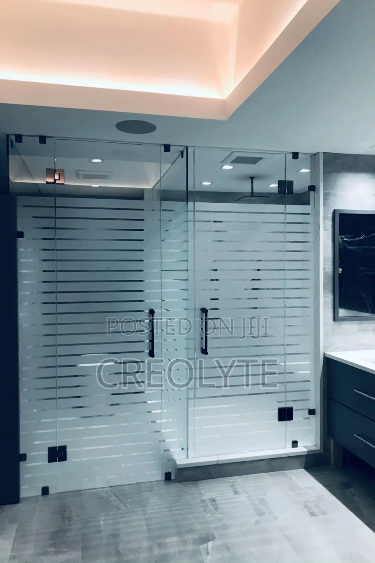 Frameless Glass Showerenclosure Horizontally Striped Frosted Pattern.