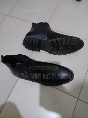 These Black Chelsea Boots Feature a Lug Sole for Added Traction.