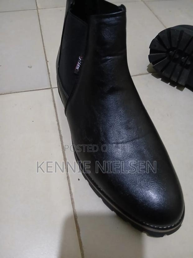 These Black Chelsea Boots Feature a Lug Sole for Added Traction. - thumbnail 2