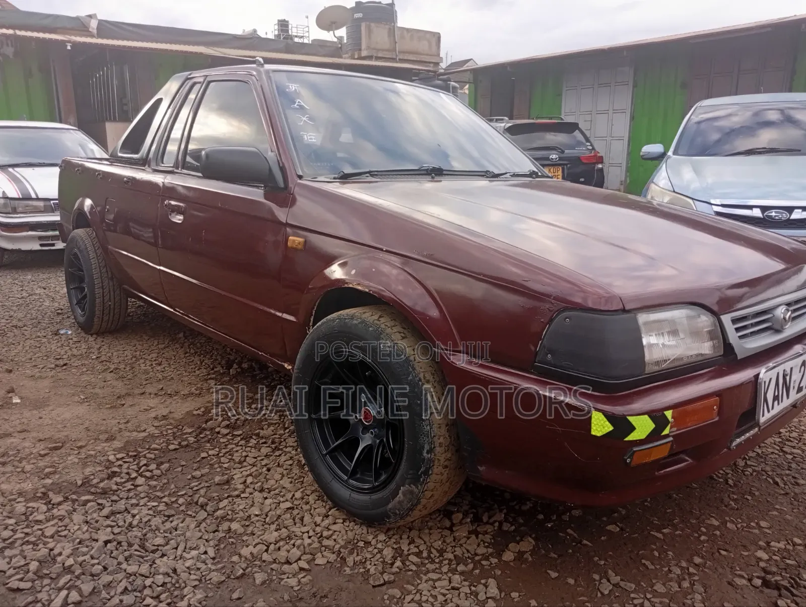 Mazda 323 1996 Maroon