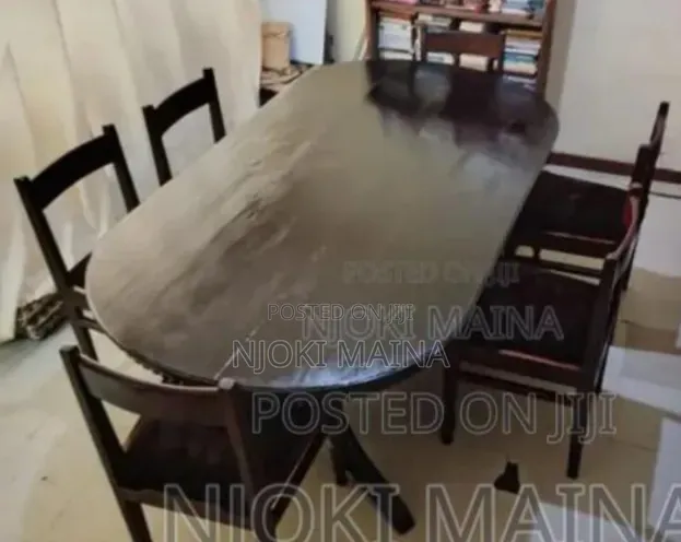 A 6 Sitter Antique Mahogany Dining Set