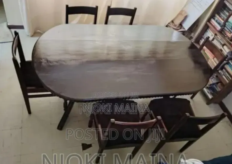 A 6 Sitter Antique Mahogany Dining Set