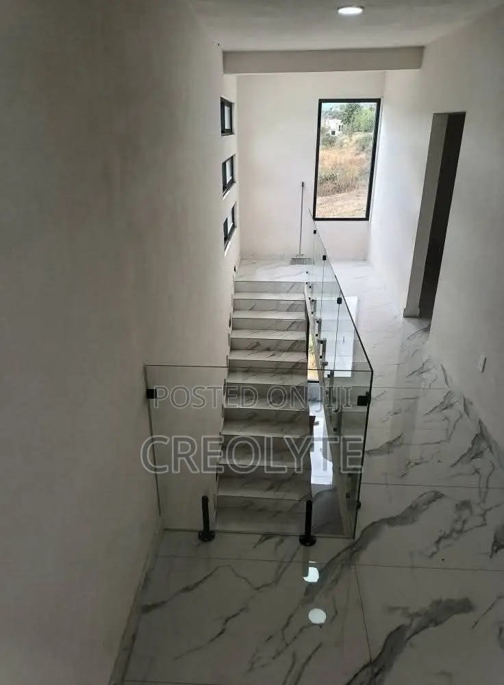 Frameless Glass Balustrade | Matte Black Spigots | Staircase Landing