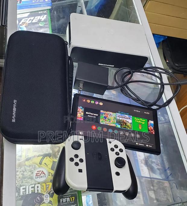 Nitendo Switch Oled Complete With All Accessories.