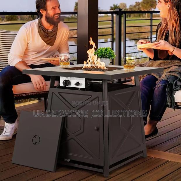 Propane Fire Pit Table With A Black Iron Frame And Ceramic Top. - main view