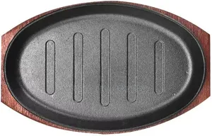 Cast Iron Hot Sizzling Plate With a Wooden Tray