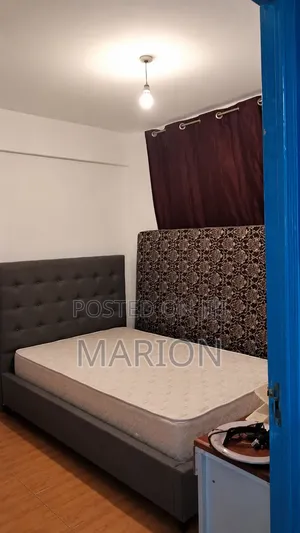 A Standard Bed and Mattress