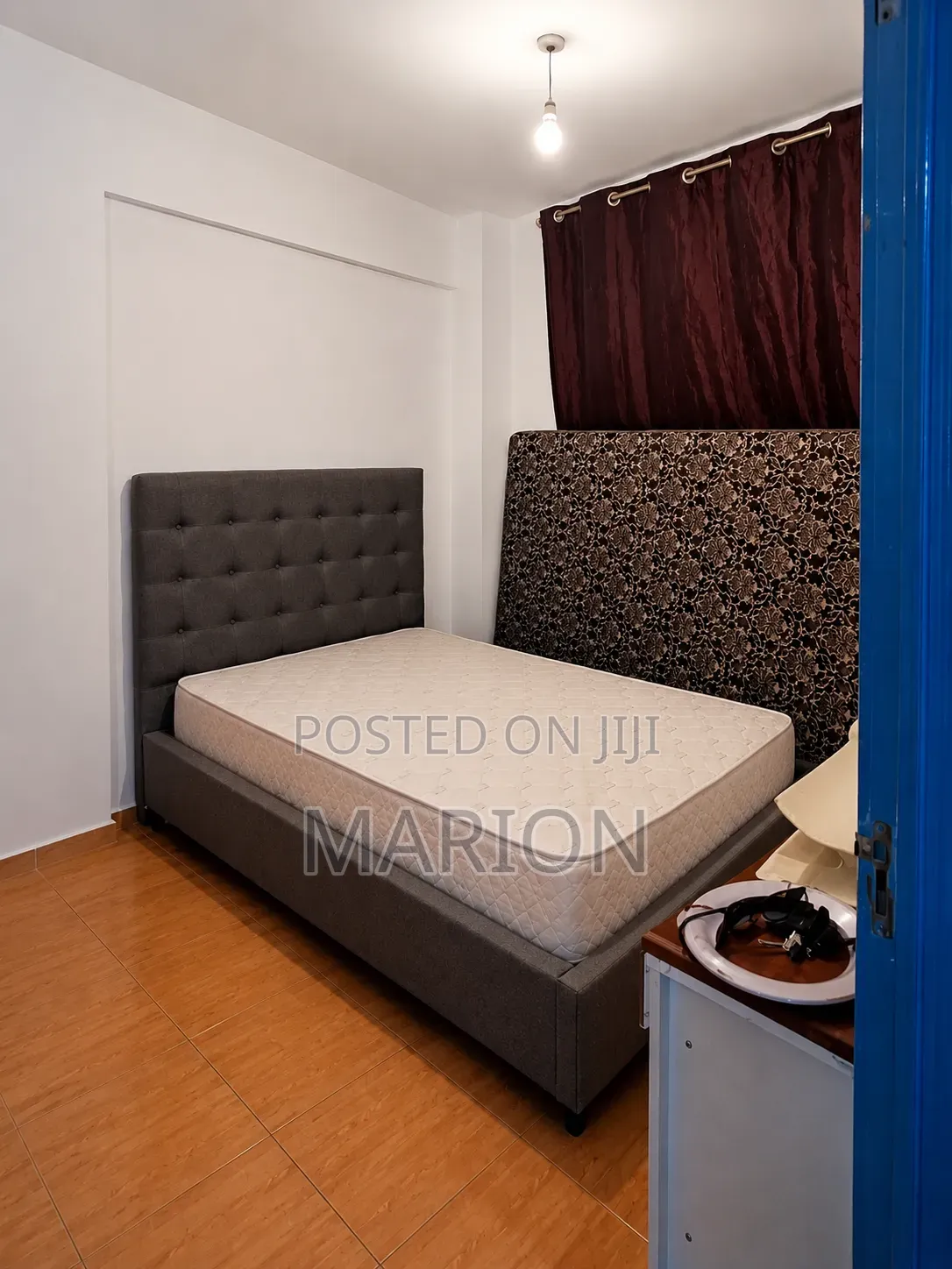 A Standard Bed and Mattress