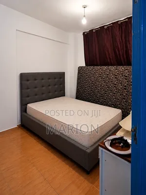 A Standard Bed and Mattress