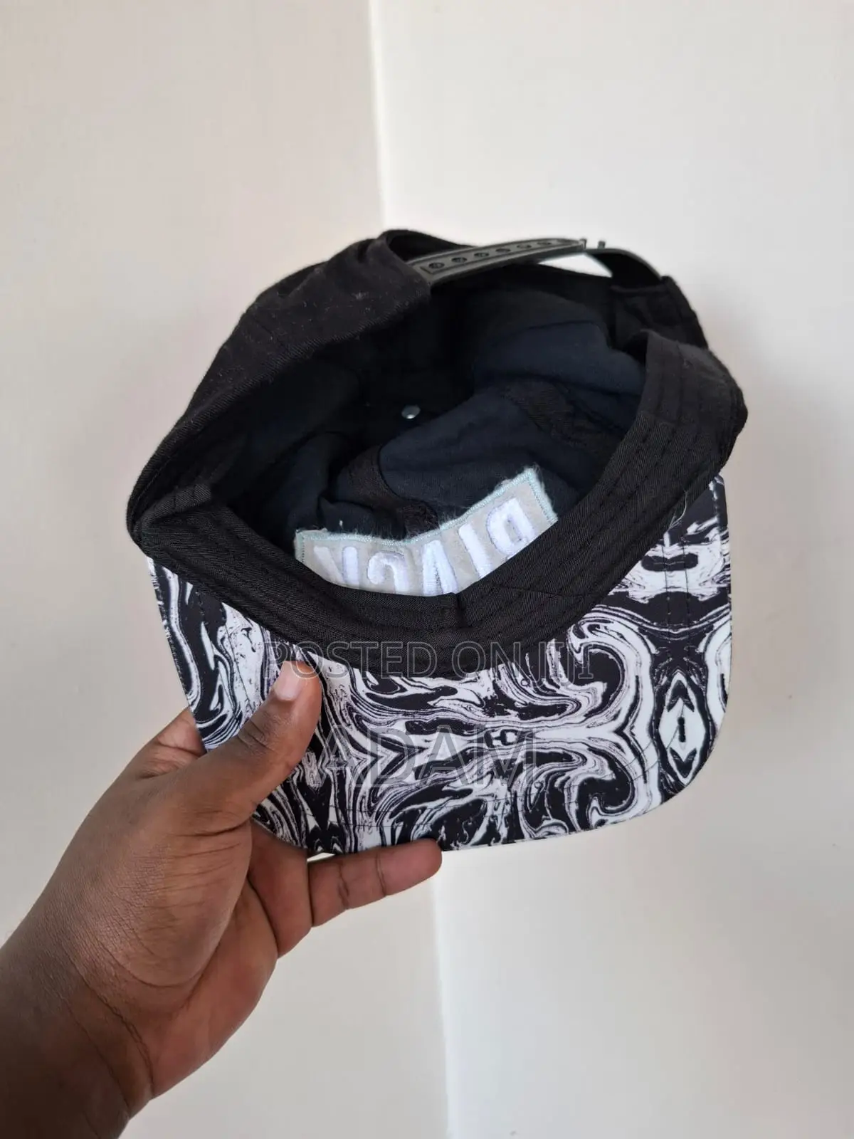 Black Embroidered Cap With Marble-Print Brim