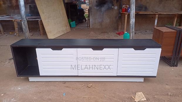 Black and White Faces Tv Stand