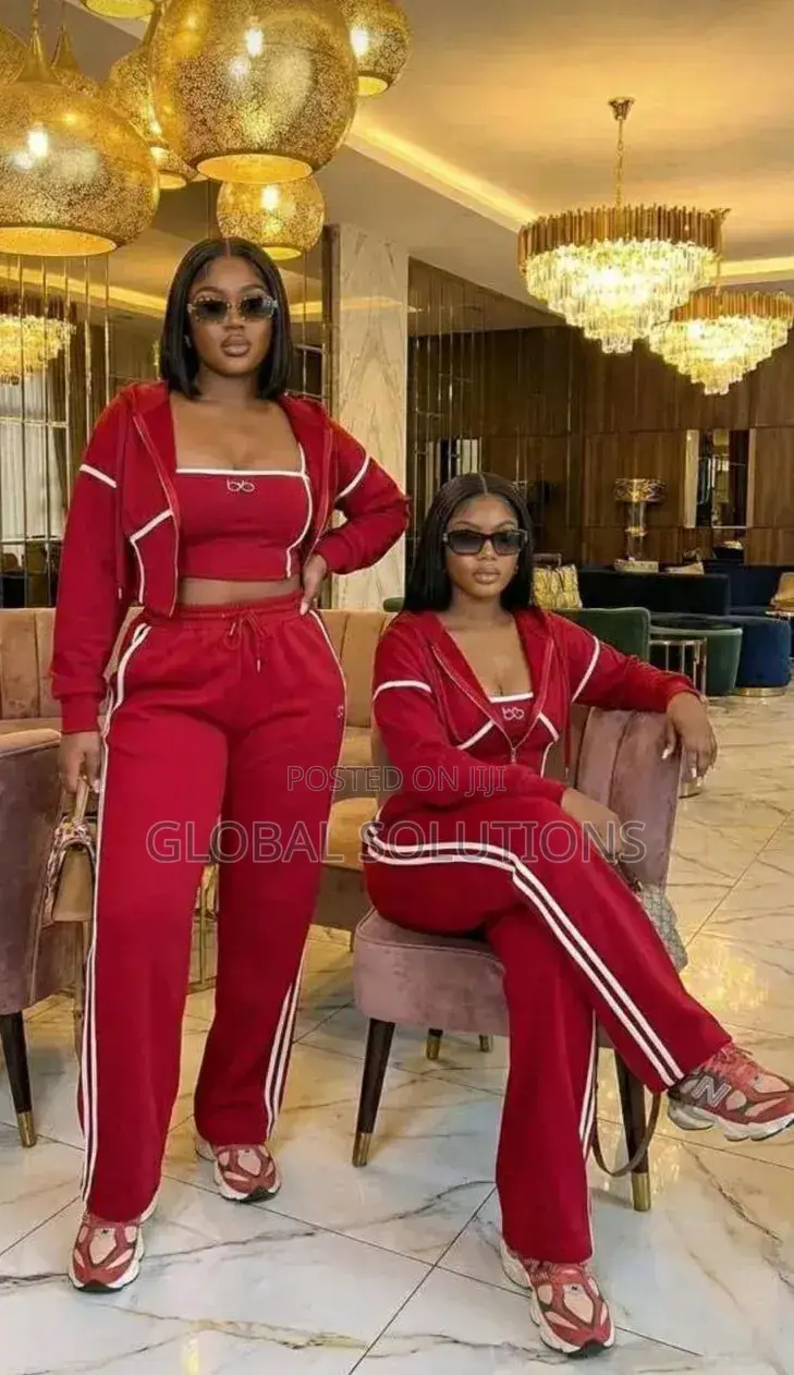 Three-Piece Tracksuit Set Features a Branded Crop Top and Jacket