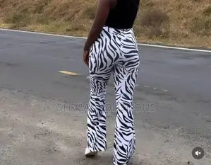 Fashion Nova Boho Dreams Zebra Flare Pants
