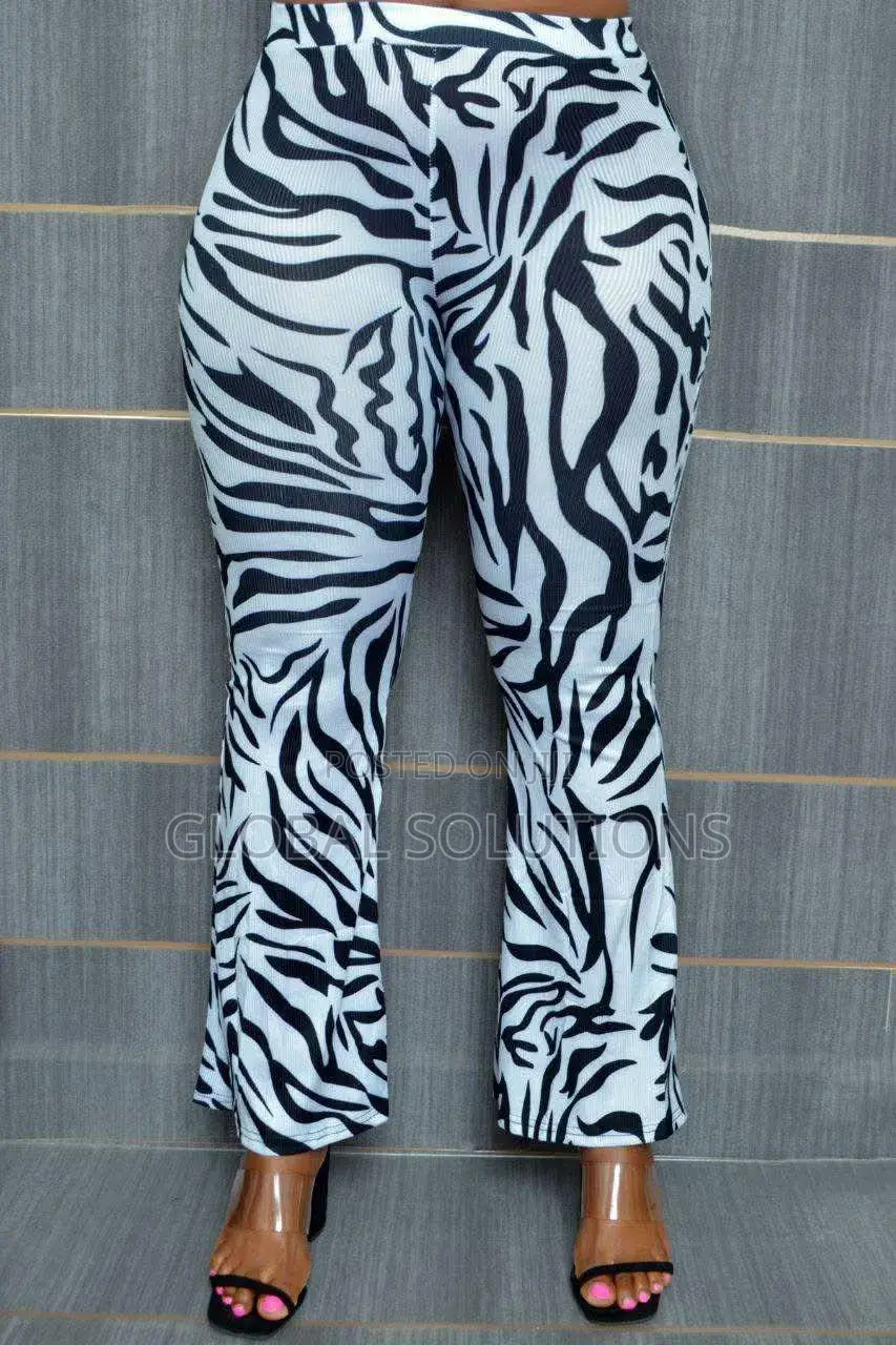 Fashion Nova Boho Dreams Zebra Flare Pants