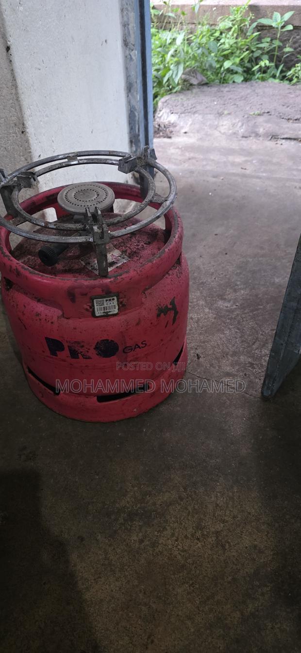 Empty Gas Cyclinder With Burner and Grill
