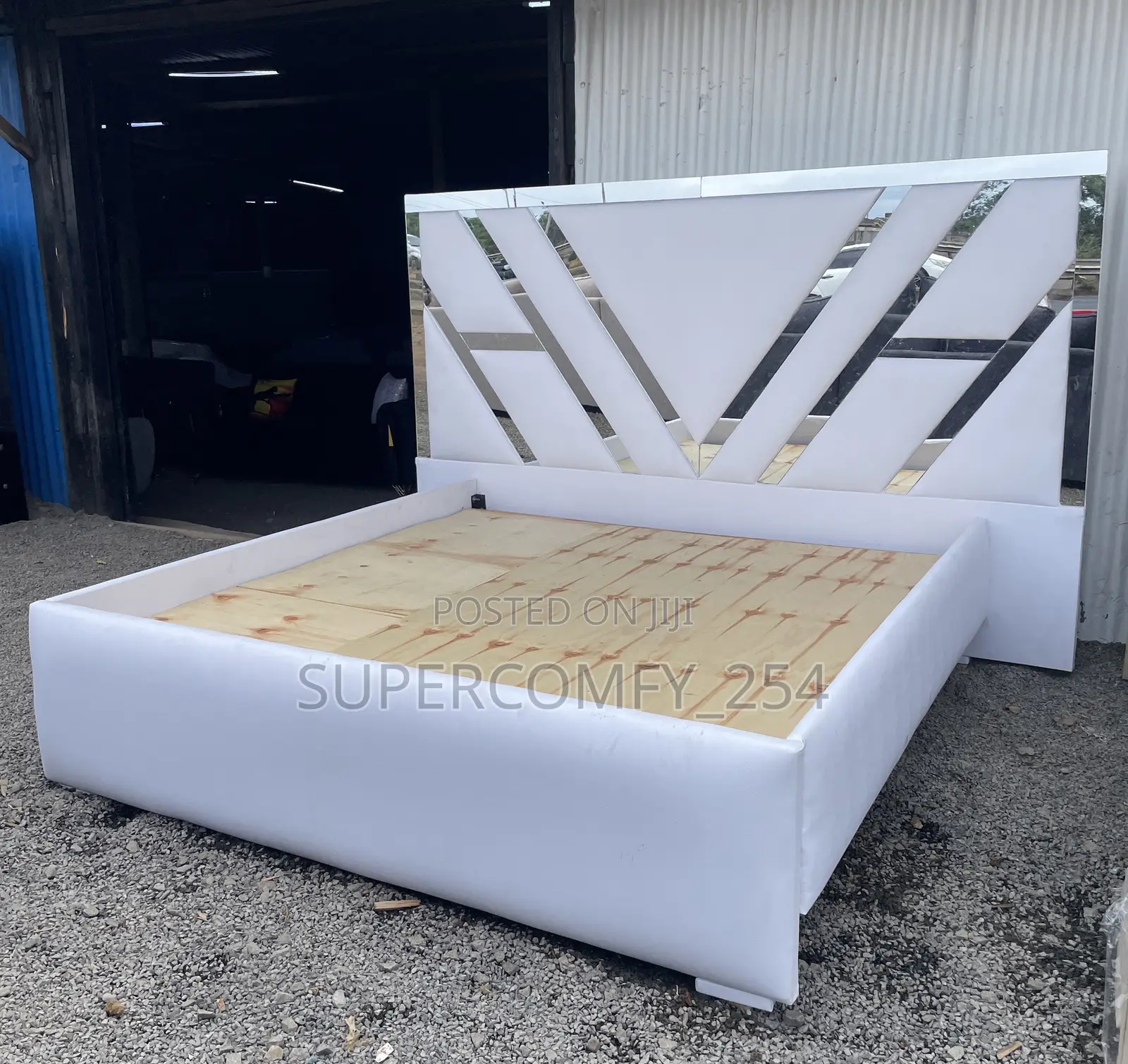 Extended Headboard Bed With Reflective Mirrors