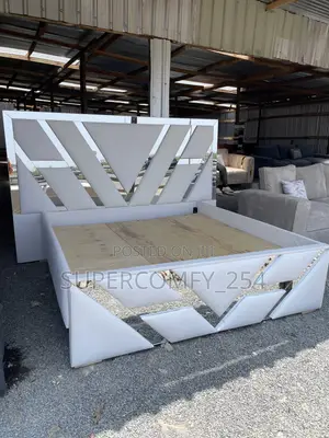 Extended Headboard Bed With Reflective Mirrors