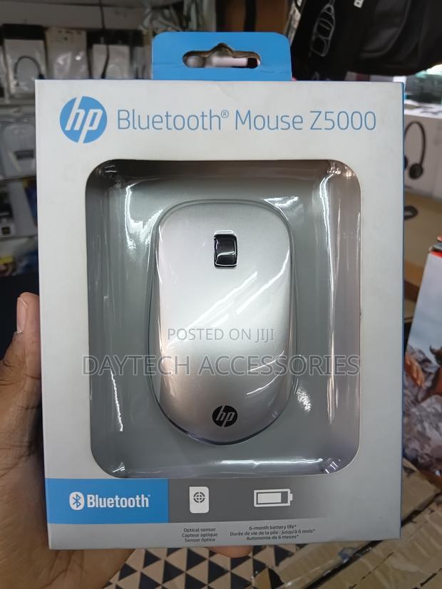 This Is an Hp Bluetooth Mouse Z5000 Featuring a Sleek Silver Design. - thumbnail 3