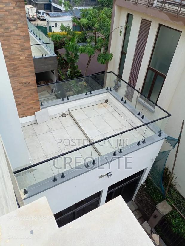 Frameless Glass Rooftop Terrace Balustrade With Black Spigots