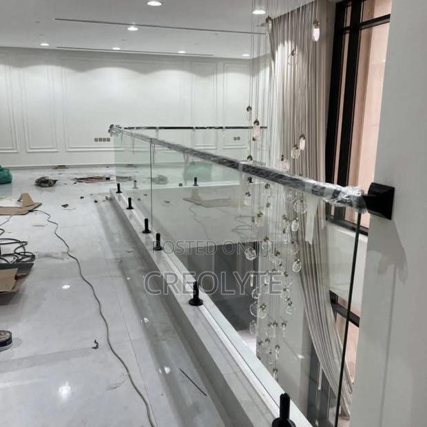 Frameless Glass Landing Balustrade With Black Spigots
