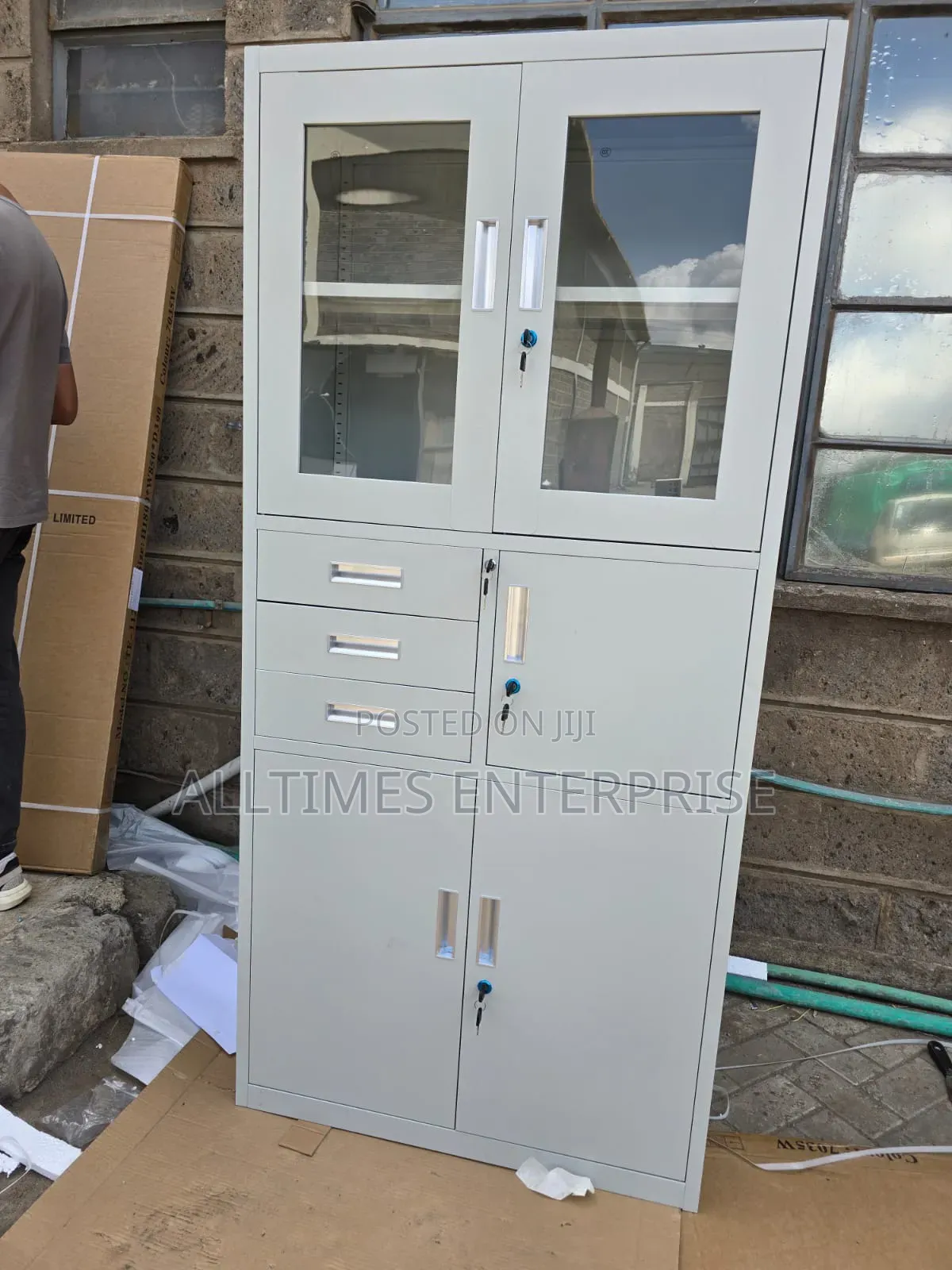 Steel Office Filing Cabinet With Glass Doors and Drawers".